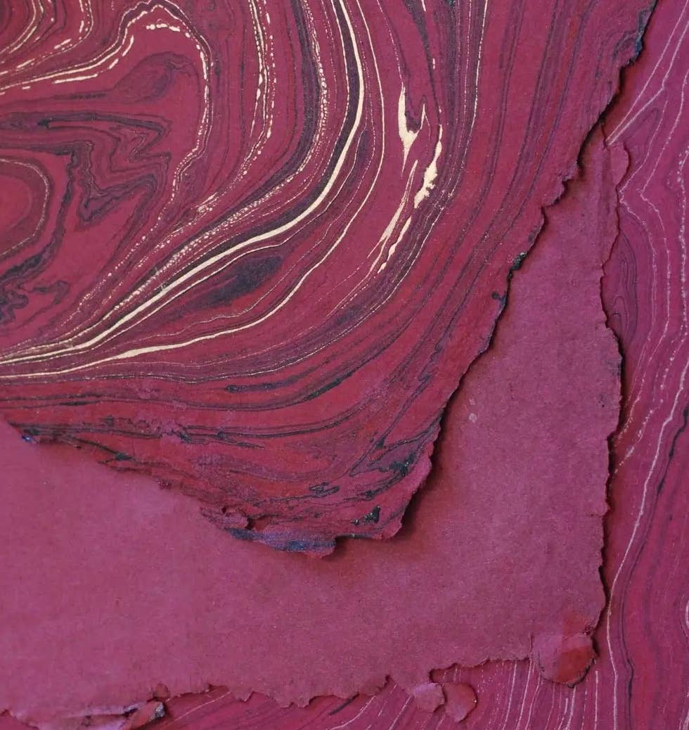 Richly textured hand marbled paper in red with gold accents, crafted by The Casual Bookbinder, perfect for the Softcover Notebook.