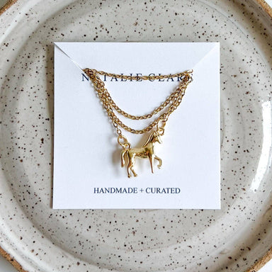 The Horse Girl Necklace features a dainty horse pendant, perfect for the equestrian fashionista who likes to keep it classy while dreaming of galloping through fields.