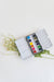 Versatile 12 Color Mini-Travel Watercolor Paint Palette featuring a refillable watercolor brush for easy painting.
