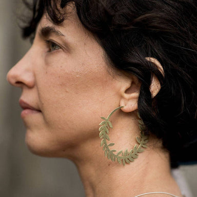 woman wearing Flora Brass Hoop
