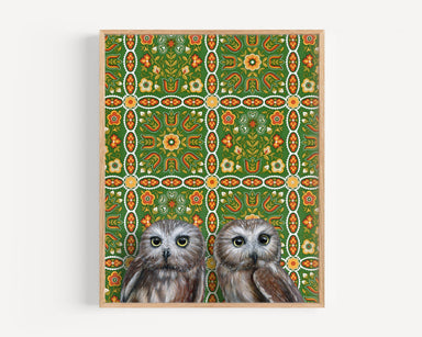 Framed art print of two owls on a patterned background.