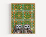 Framed art print of two owls on a patterned background.