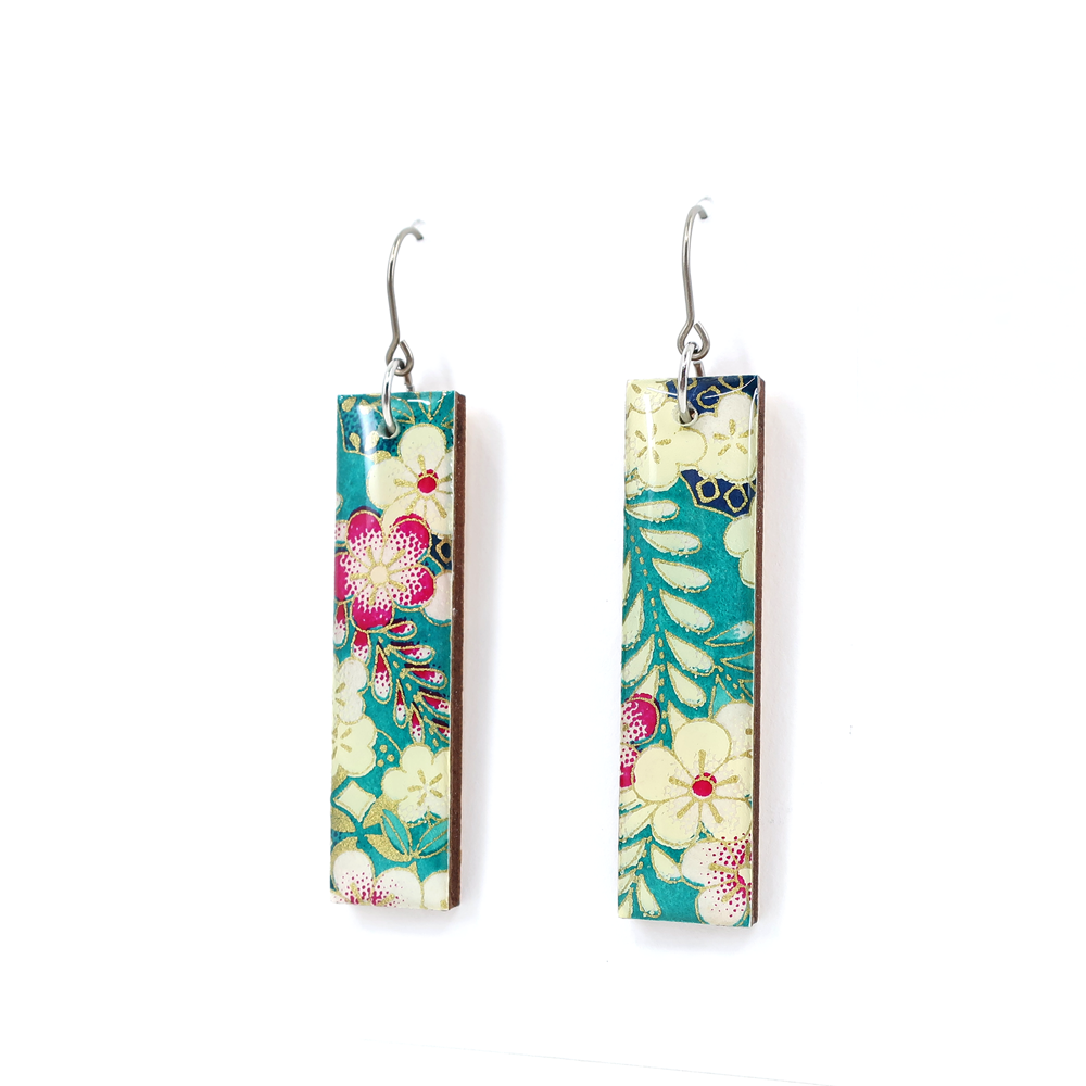 Teal floral Chiyogami long bar earrings with titanium hooks displayed on a white background