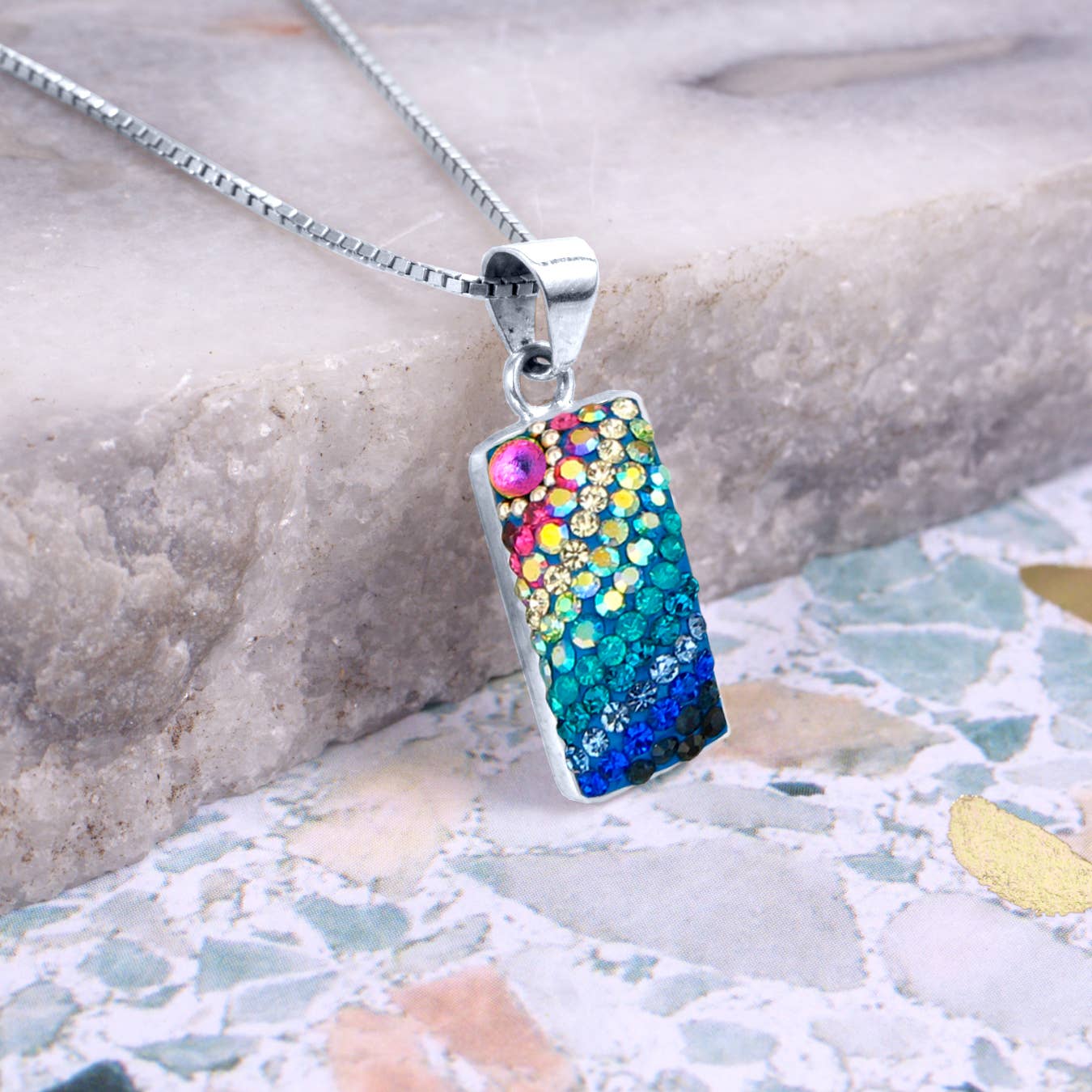 Close-up of Sparkle Streak Pendant highlighting its playful design and lightweight elegance, ideal for catching the light and turning heads.