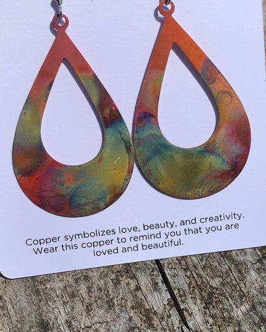 Close-up of the Boho Large Open Teardrop Fire Painted Copper Earrings, highlighting the intricate craftsmanship and fiery designs.
