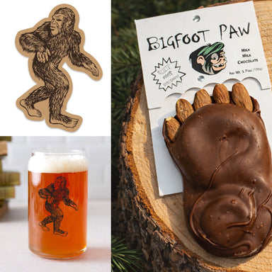 The Bigfoot Sighting Set featuring a chocolate paw, a Santa Cruz Bigfoot sticker, and a Bigfoot beer glass for celebrating sightings.