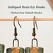 Antiqued Brass Ear Hooks showcased with Turquoise and Gold Collar Earrings by The Artifact House, highlighting the nickel-free default hooks in a clean and styled setting.