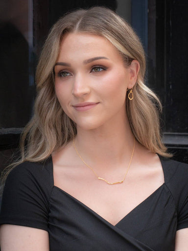 Nina Earrings showing their subtle abstract design - perfect for when you want your accessories to outshine your personality (but good luck with that!)!