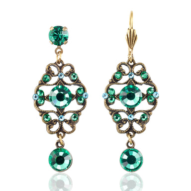 Ornate earrings with green gemstones 
