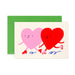 Cheerful artwork of two hearts holding hands, showcasing vibrant colors, by Karen Schipper from the Mini Note Card Collection.