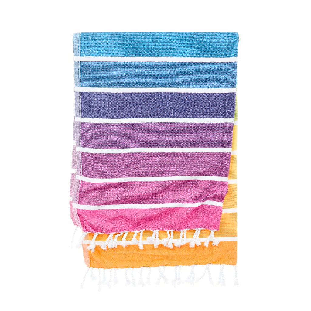 Whimsical Neapolitan Turkish Towel with playful tassels, perfect for snuggling up or pretending you're on a tropical vacation.