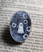 ghost wooden pin surrounded by dried flowers