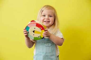 Little girl holding Lion tambourine