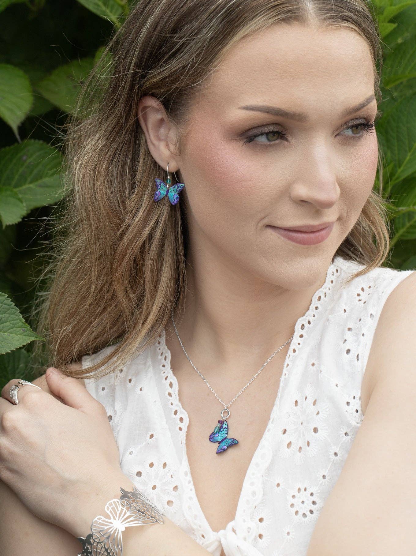 Mariposa Butterfly Earrings being worn, turning heads with their quirky and dreamy charm—because who doesn’t want butterflies dancing near their lobes?