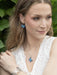 Mariposa Butterfly Earrings being worn, turning heads with their quirky and dreamy charm—because who doesn’t want butterflies dancing near their lobes?
