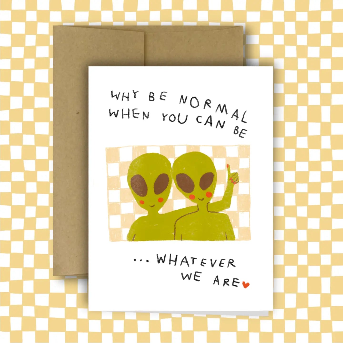 Card with two green aliens and text on a checkered background