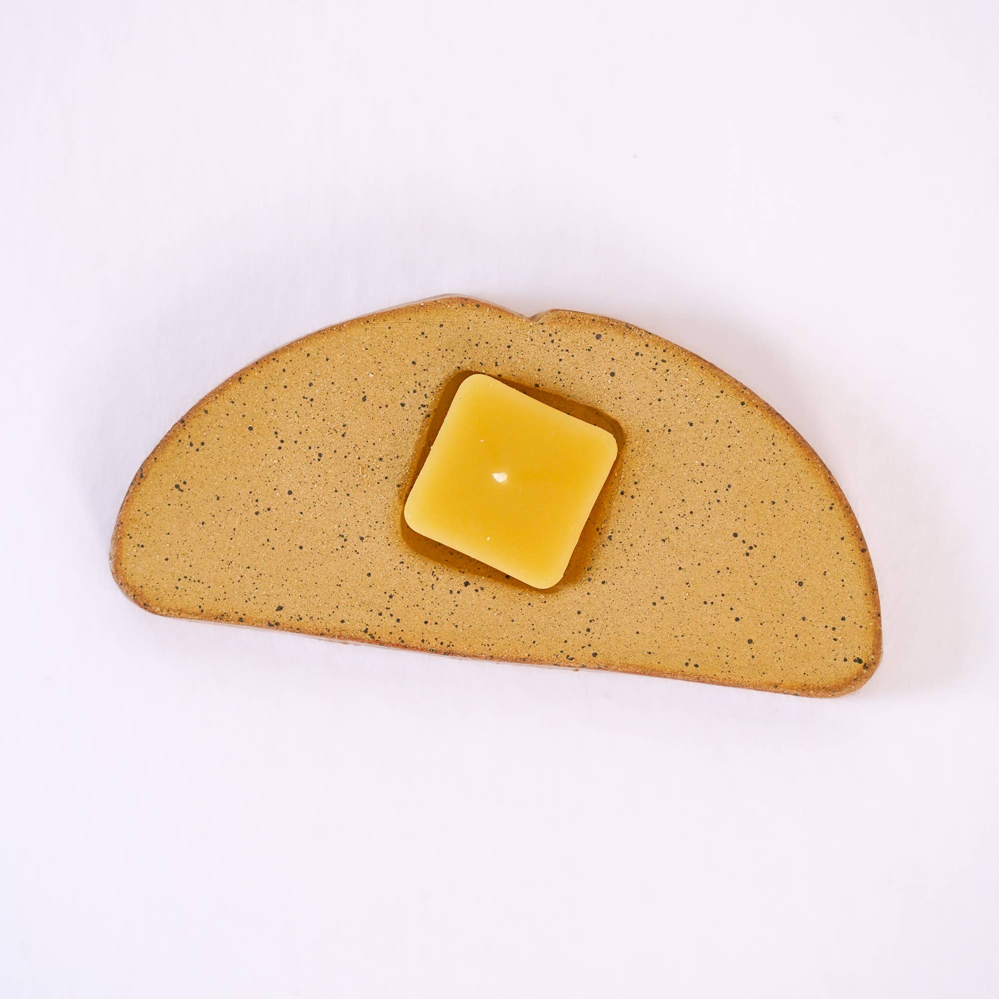 ceramic toast with butter candle holder