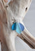 Close-up of the Blue Eco Glass Trio Sterling Silver Necklace, highlighting the frosted texture of the eco-friendly blue glass, crafted to resemble sea glass.
