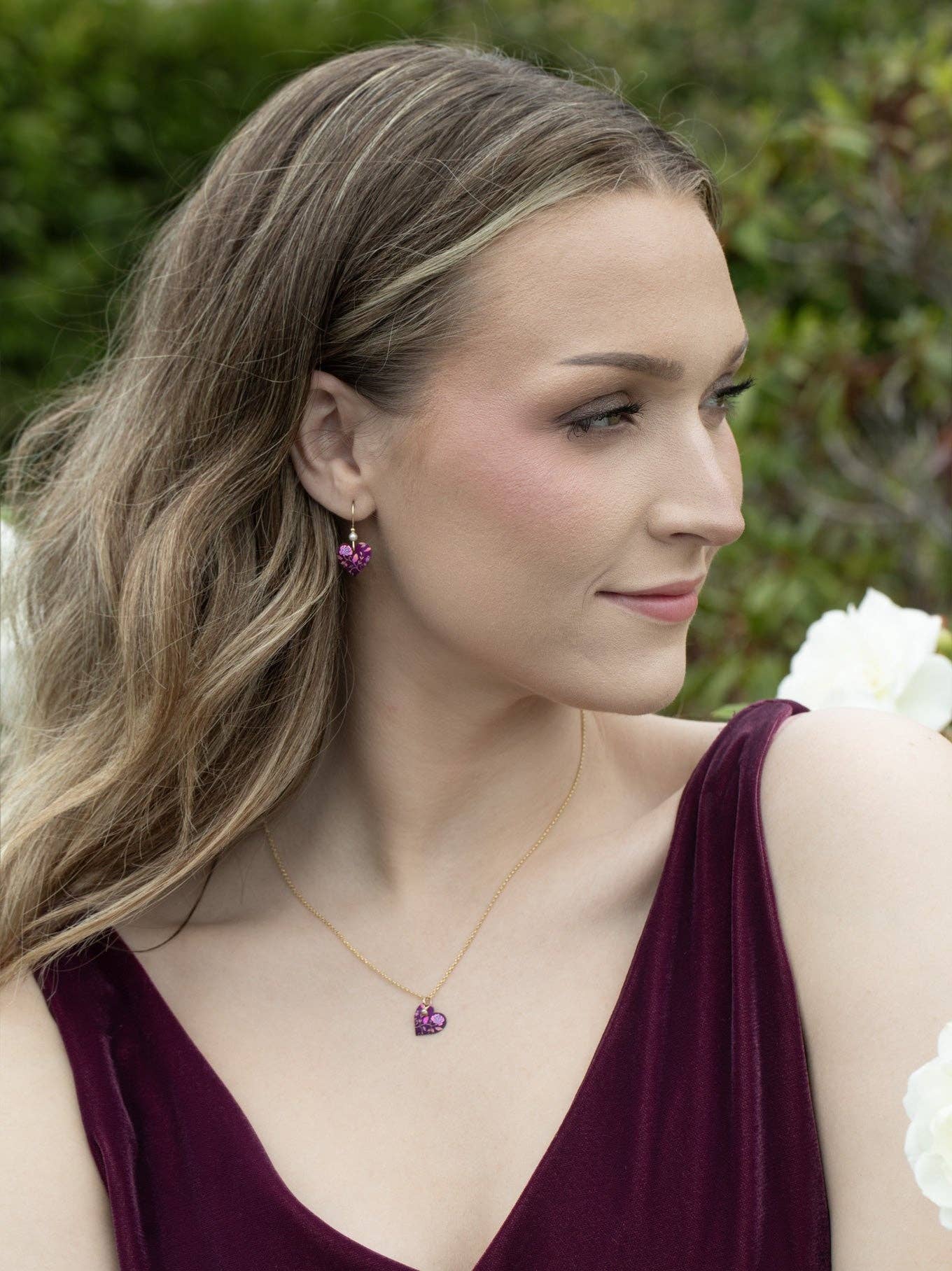 Budding Heart Pendant showcased elegantly, flaunting its gold plating and freshwater pearl, proving big hearts come in small packages.