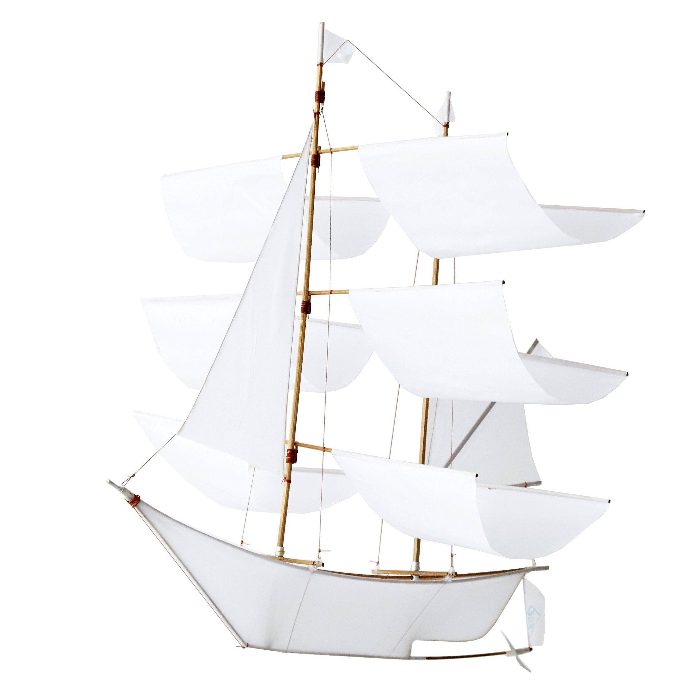 Classic white Sailing Ship Kite by Haptic Lab, designed for flying and as a decorative baby mobile, featuring a handcrafted bamboo frame and ripstop nylon sails.