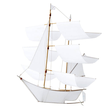 Classic white Sailing Ship Kite by Haptic Lab, designed for flying and as a decorative baby mobile, featuring a handcrafted bamboo frame and ripstop nylon sails.