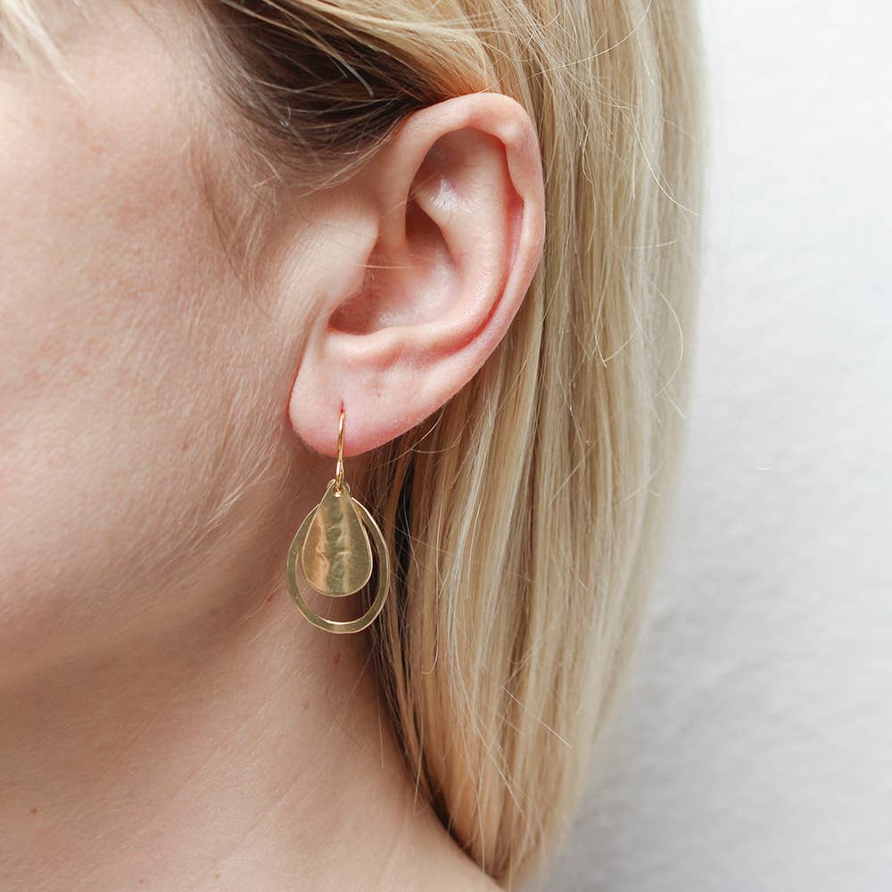 Model wearing Curved Teardrop and Teardrop Rings Wire Earrings, highlighting their fun and cute design with an eye-catching look.
