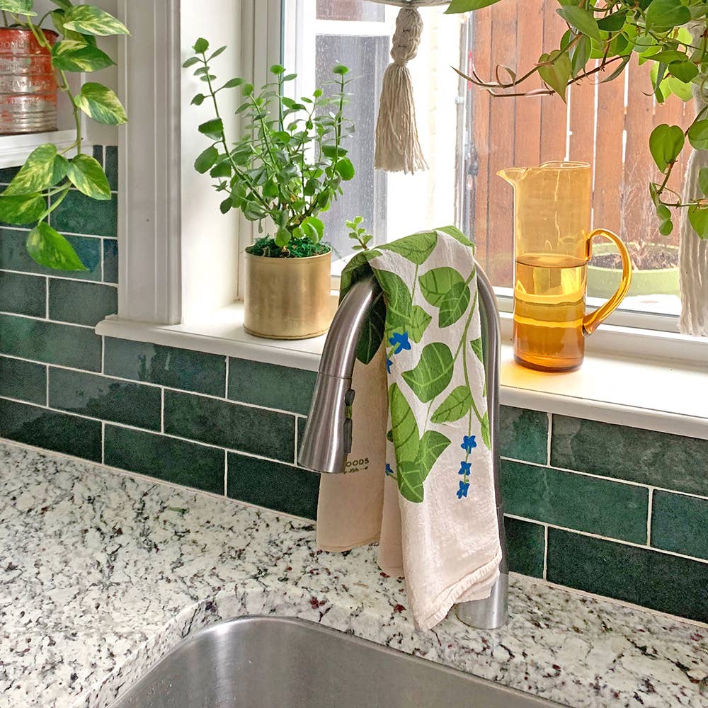 Close-up view of the Tomato Basil Tea Towels, showcasing colorful tomato and basil graphics on 100% cotton material.