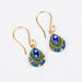 Chic 18K Gold Plated Crystal & Gold Petite Dew Drop Earrings rocking vibrant blue crystals, because who needs a superhero cape when you can wear dazzling earrings instead?