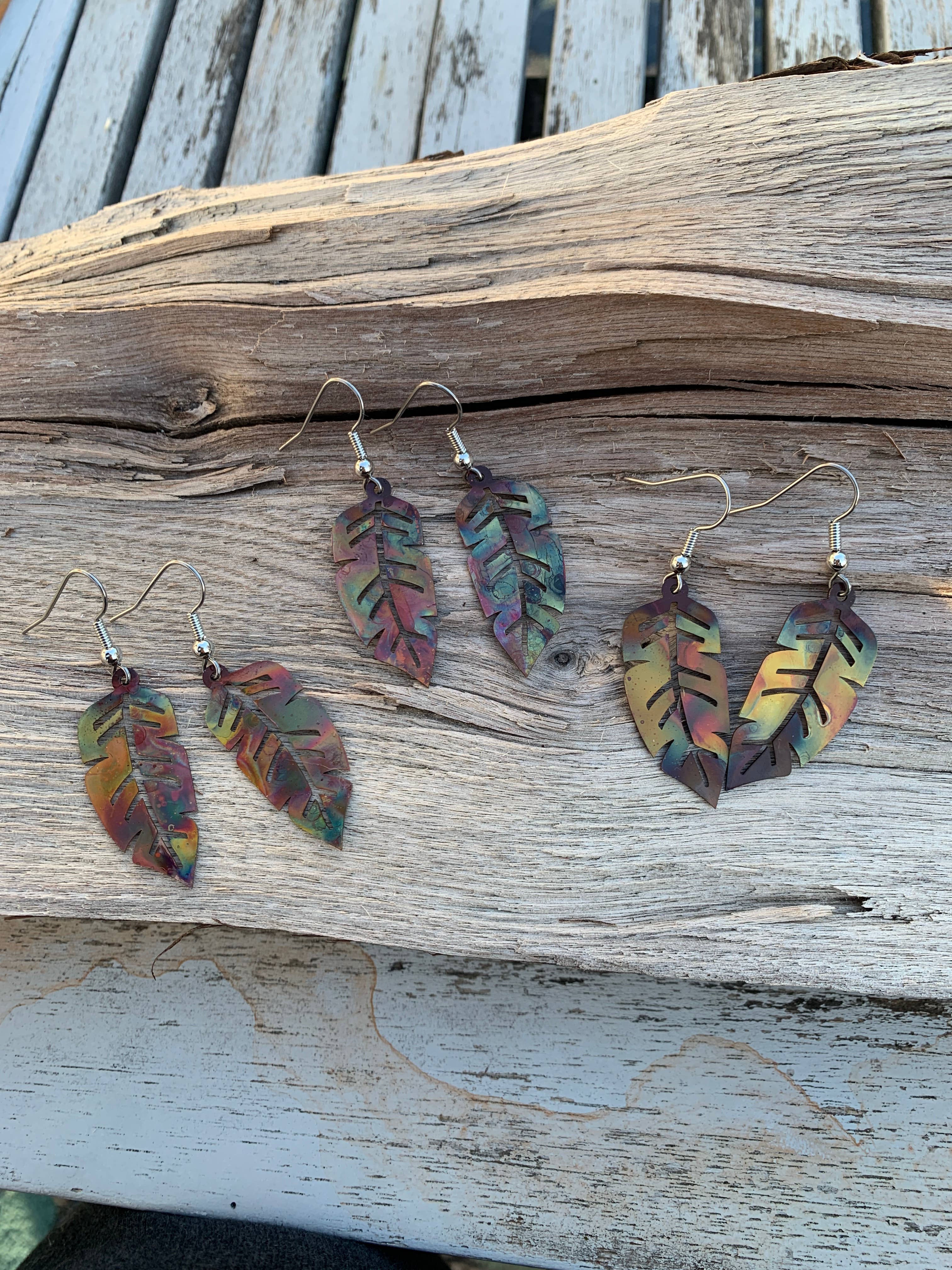 Close-up view of lightweight Western Feather Copper Earrings with smooth stainless steel wires, perfect for all-day wear.