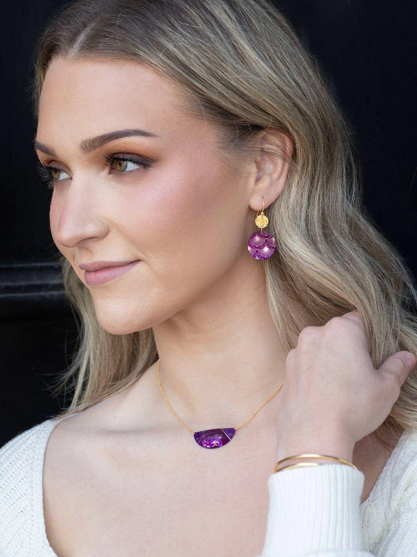 Close-up of the Danica Earrings featuring a shimmering niobium sphere and intricate constellation artwork, stylish enough for a galactic gathering!