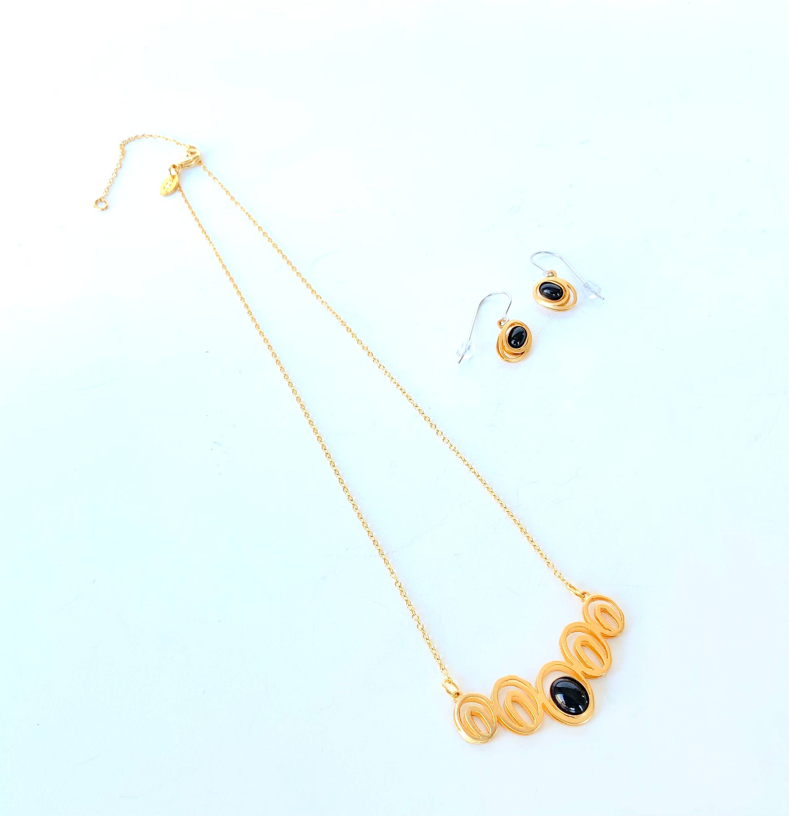 steel jewelry with black gemstones