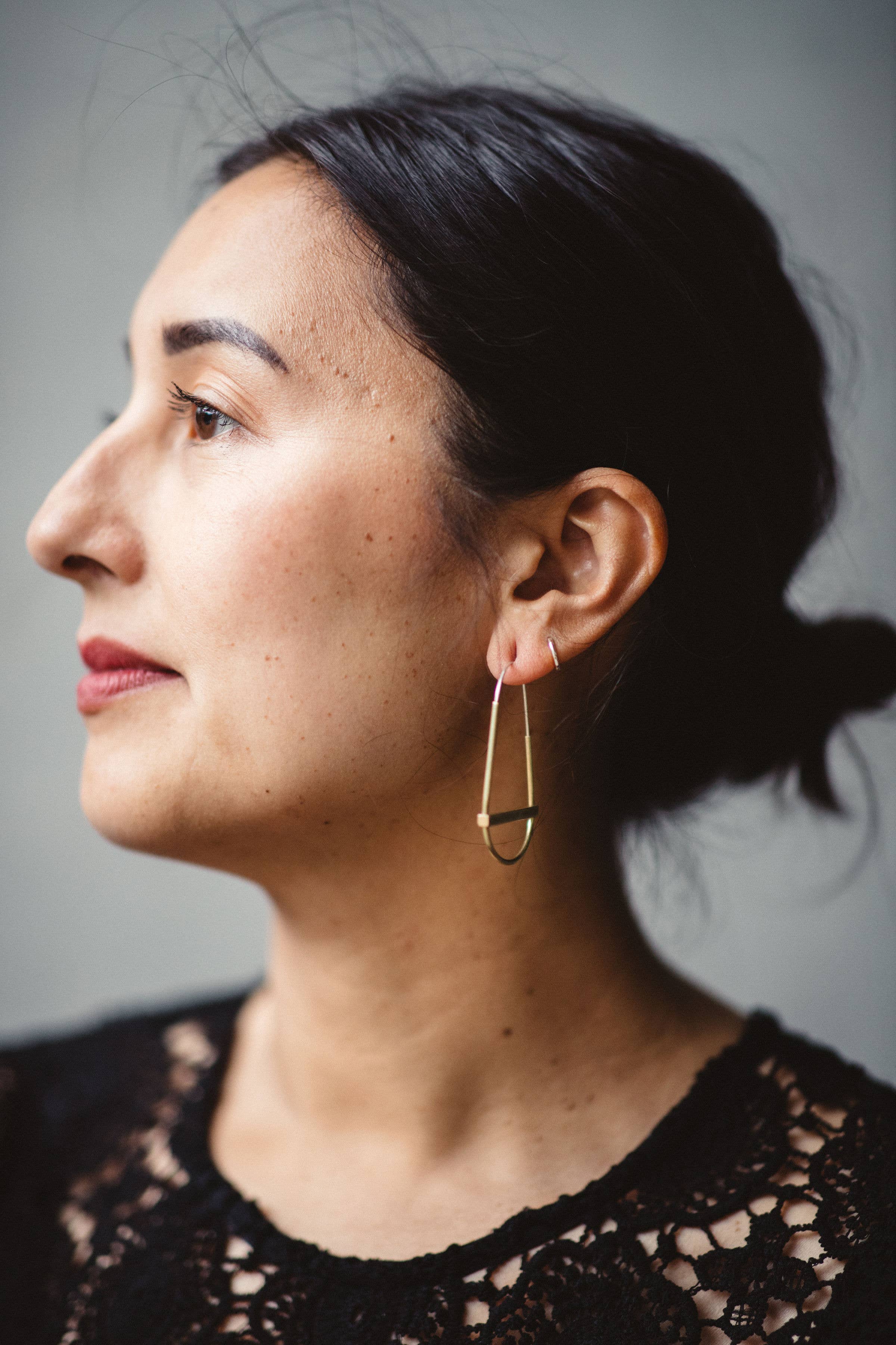 gold hollow hoop with crossbar earrings