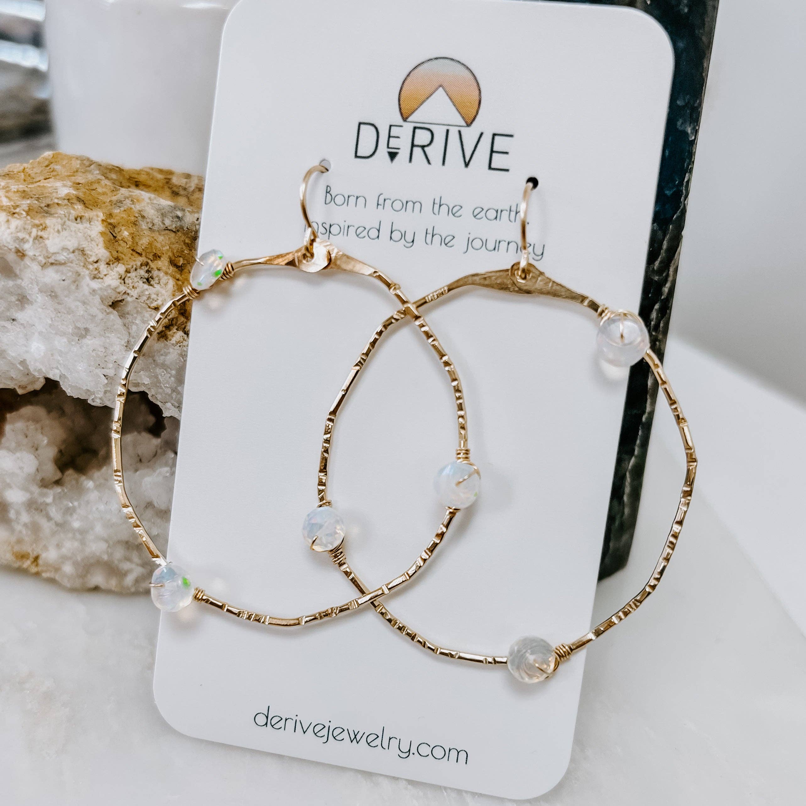 Stargazer Opal Hoop Earrings: Are they hoops or are they portals to another dimension? These hand-hammered beauties are your gateway to stunning style!
