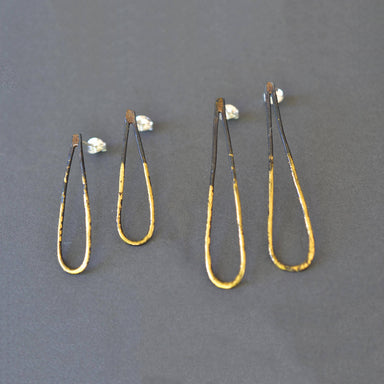 Narrow Drop Earrings in blackened steel with 23k gold leaf, slim teardrop design, and sterling silver posts—minimalist jewelry with a little golden drama.