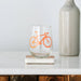 wine glass with orange bicycle print