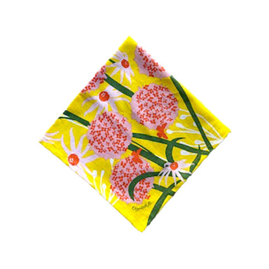 Allium Napkin Set featuring sunny floral designs printed on 100% cotton fabric, perfect for brightening up your dining table.