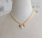 Gold curb chain necklace featuring celestial charms: an amethyst star, a pearl sun, and a labradorite moon by Jill Makes, titled 'Pearl and Moon Celestial Charm Necklace'.