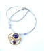 wire necklaces and earrings featuring purple beads and acrylic gemstones