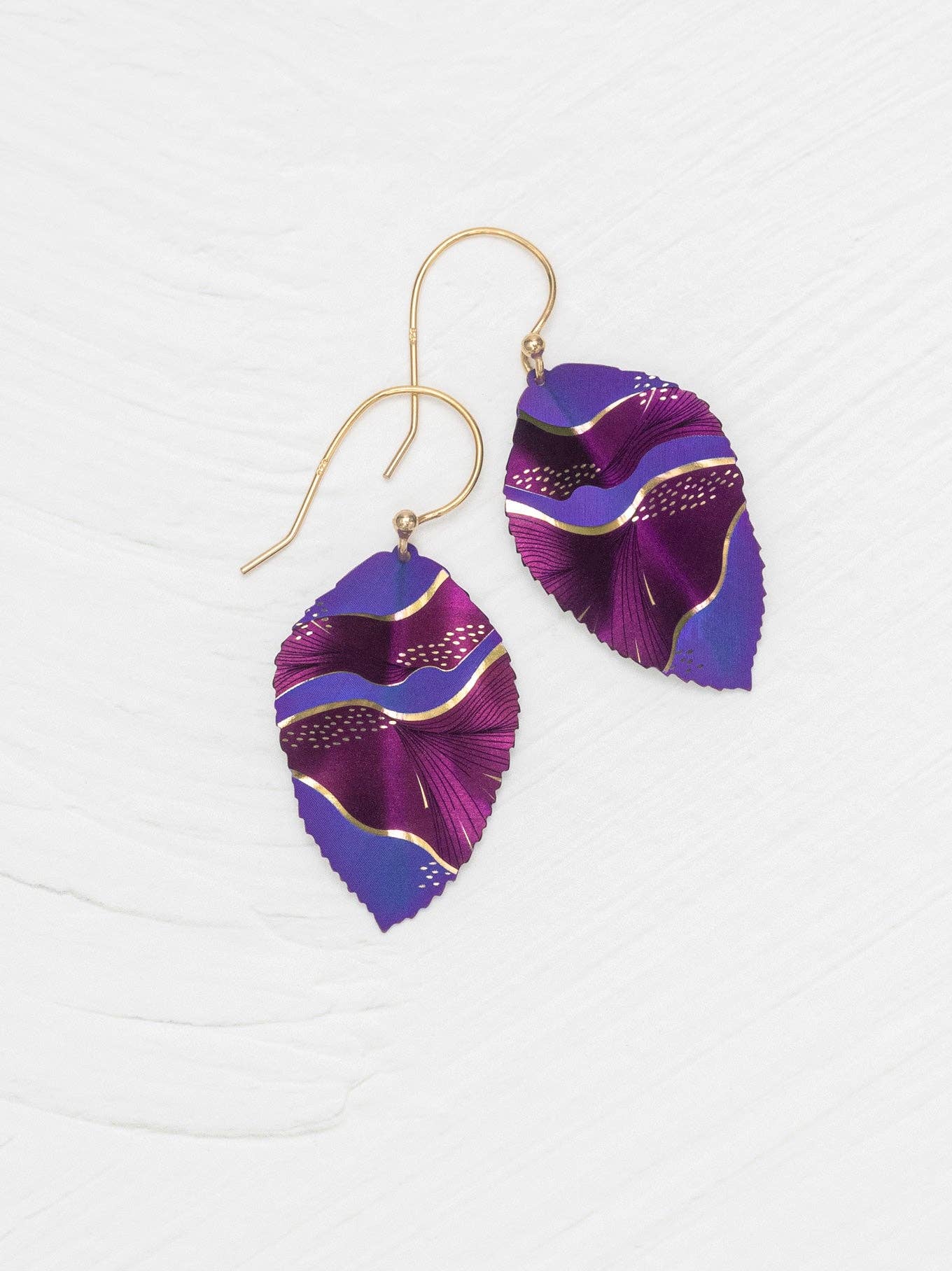 Eccentric Elm Earrings by Holly Yashi, where nature meets fancy - perfect for turning heads and dangling like the delightfully whimsical leaves they represent.