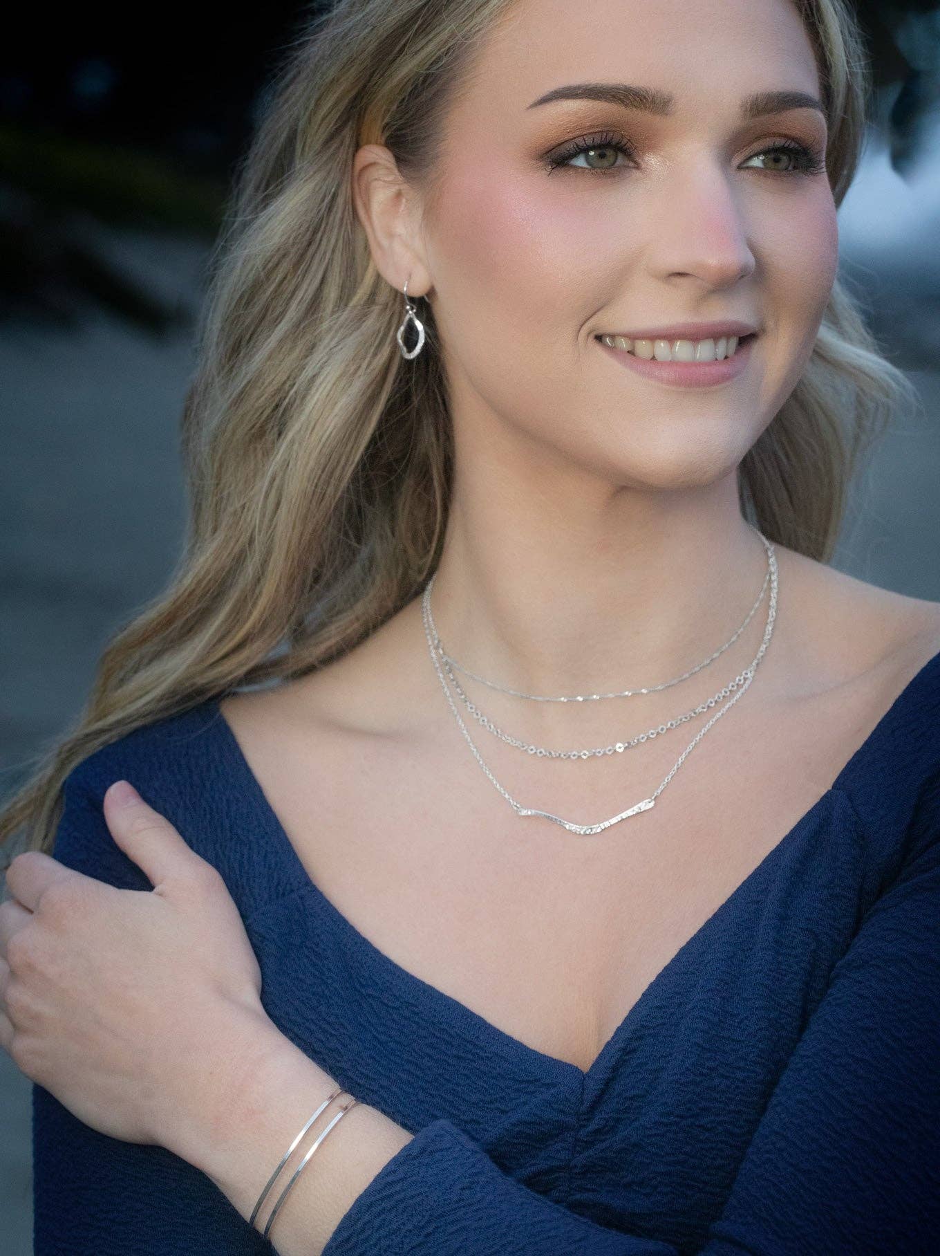 Close up of Nina Earrings' hand-hammered finish - because you deserve jewelry that’s as radiant as your wonderfully messy life!