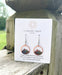 Close-up view of Circle Mountain Earrings showcasing bright colors and intricate copper detailing.