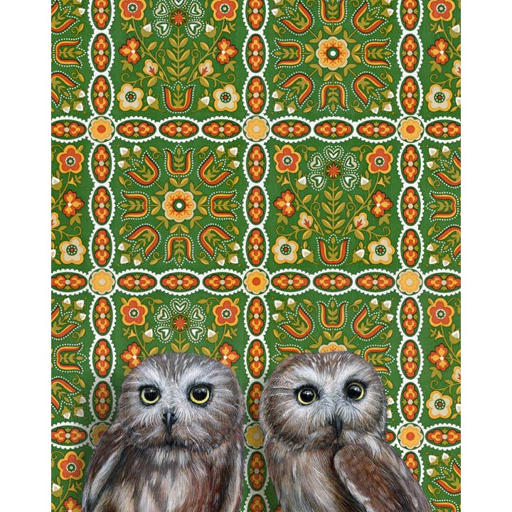 Framed art print of two owls on a patterned background.