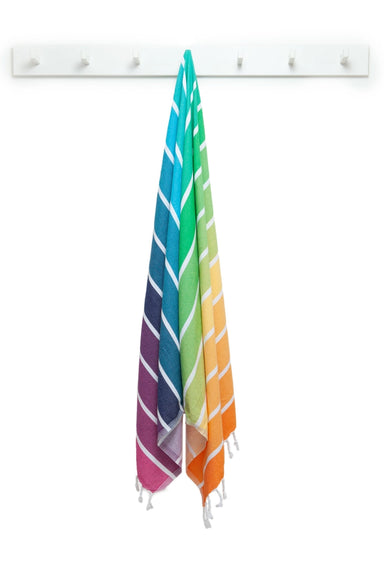 A vibrant Neapolitan Turkish Towel splashed with rainbow colors, ideal for drying off and making your beach day look fabulous.