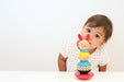 Wooden Rabbit Stacker Toy by Petit collage with little girl