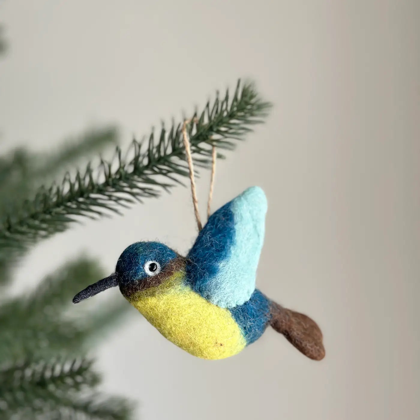 Close-up of colorful Felt Bird Ornaments showcasing their handmade details and fair-trade design.