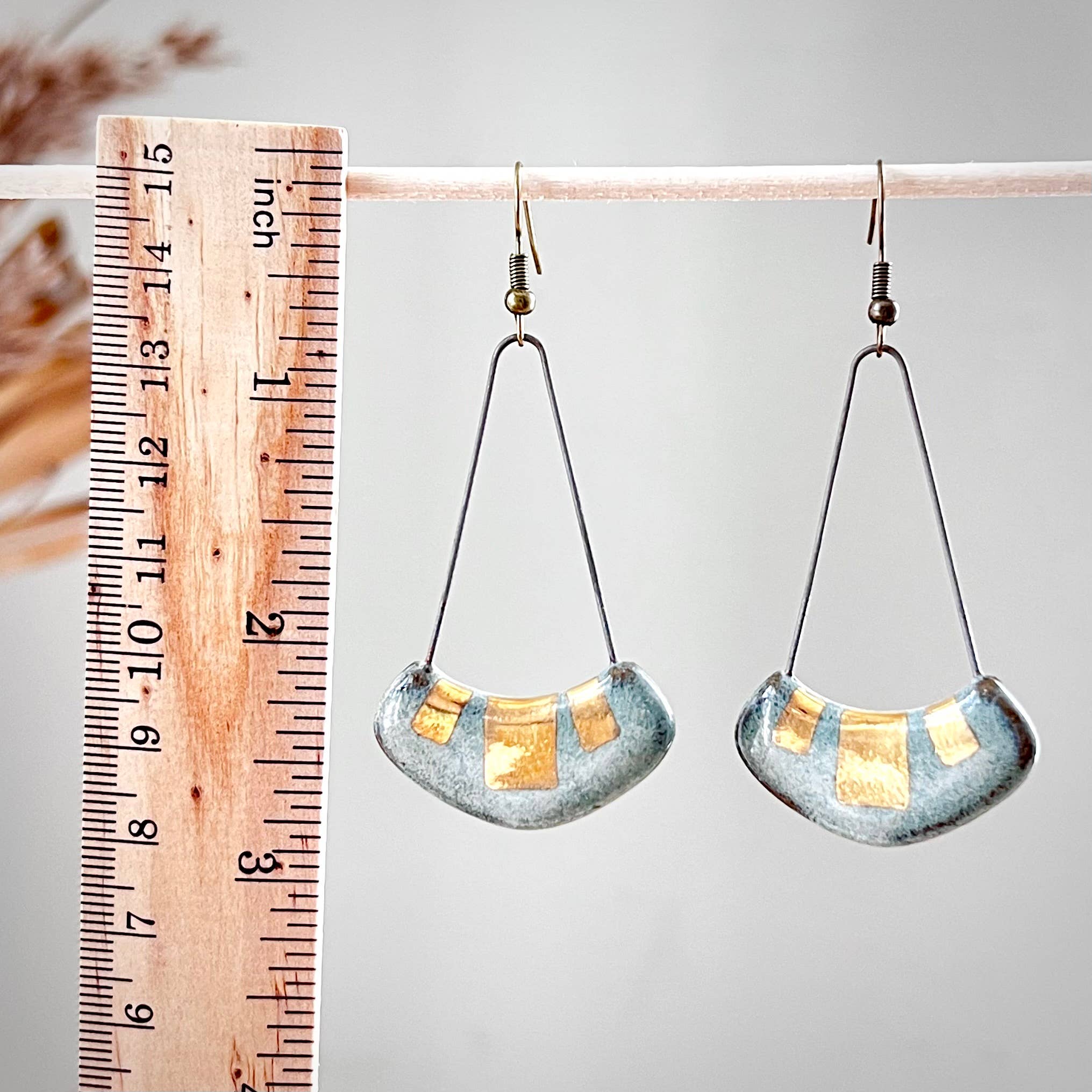 Turquoise and Gold Collar Earrings by The Artifact House, presented next to a ruler for scale, highlighting the individual ceramic pieces with turquoise glaze and gold detailing.