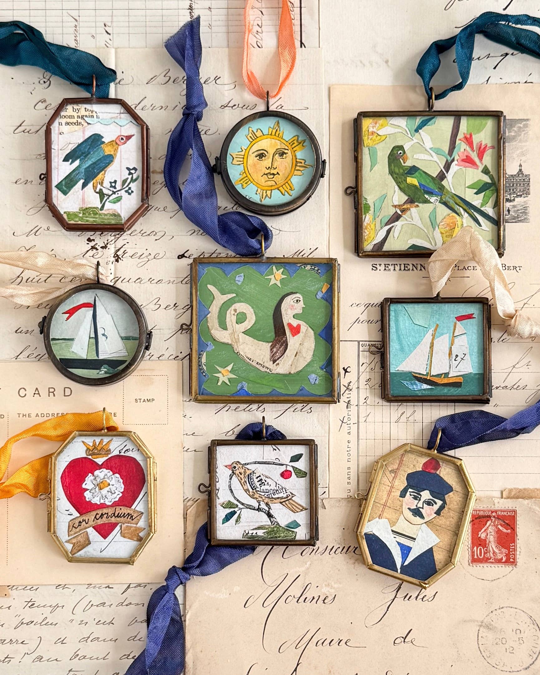 Vintage-style art locket ornaments.