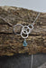 Aqua Eco Glass Sterling Silver Circle Necklace showcasing the intricate interlocking sterling silver circles and a stunning aqua Eco Glass teardrop pendant.
