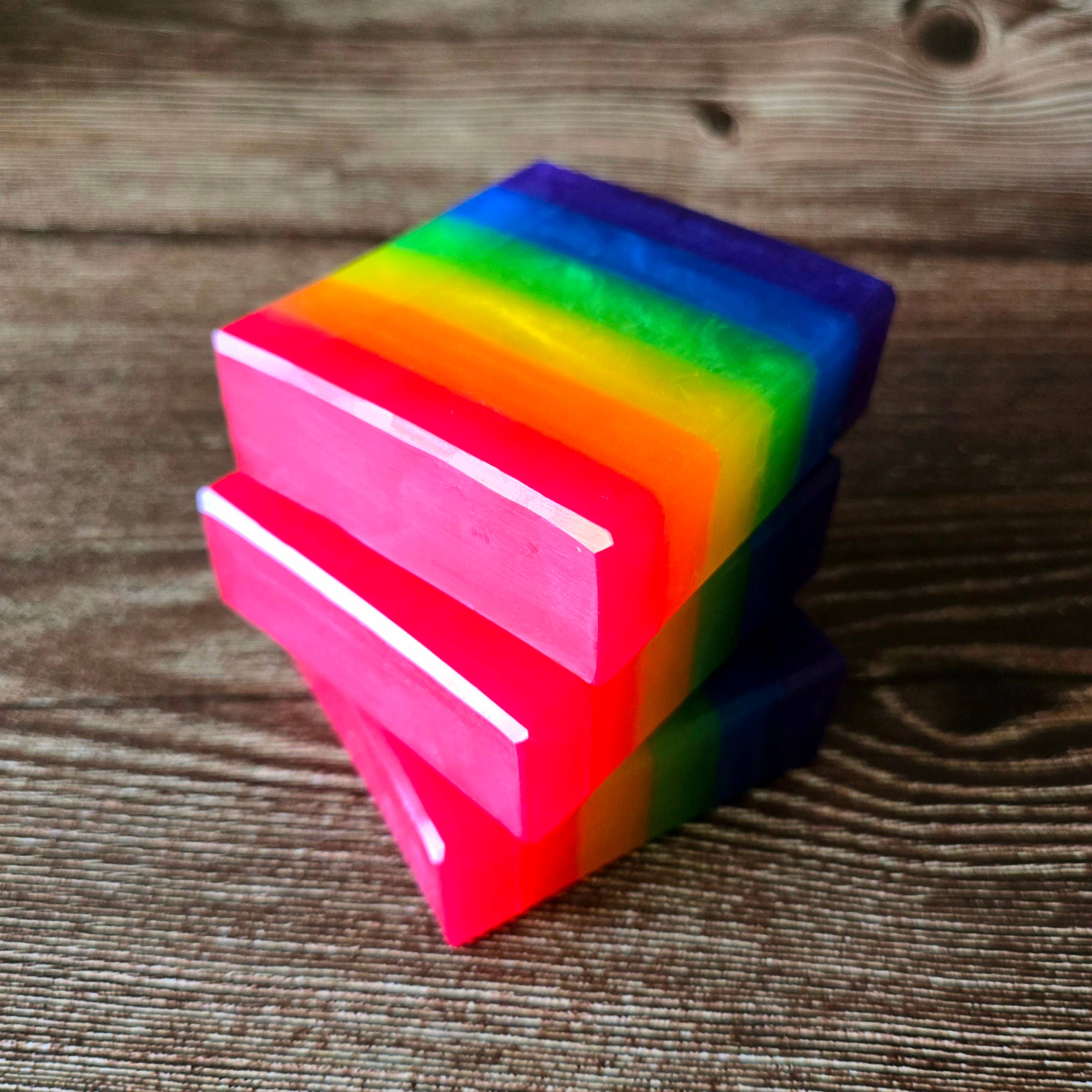 Close-up of Rainbow Pride Handcrafted Soap with captivating orange, lime, sweet berries, and coconut scents representing LGBTQ+ Pride.