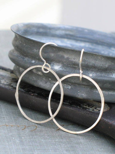 Medium Silver Hoops: Handcrafted from sterling silver, these hoops add a touch of elegance to any outfit, because who said your ears shouldn't have a good time?